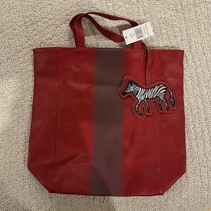Red leather bag with zebra stitch bag accessory